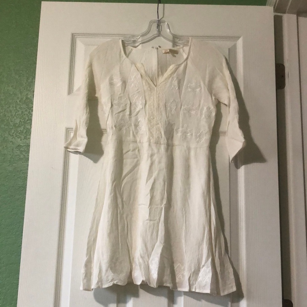 White linen dress with embroidery details